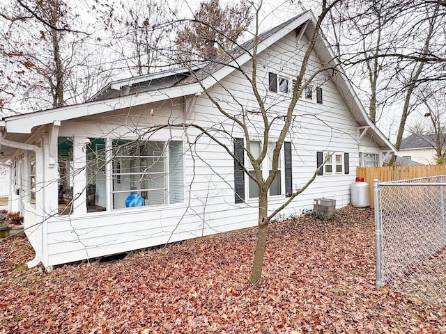 back of property featuring central air condition unit