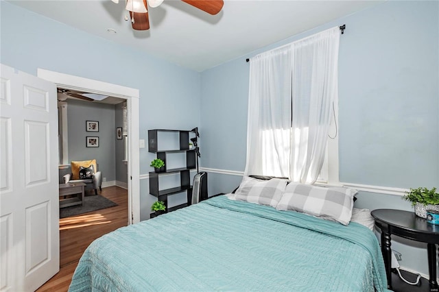 bedroom featuring ceiling fan and hardwood / wood-style flooring