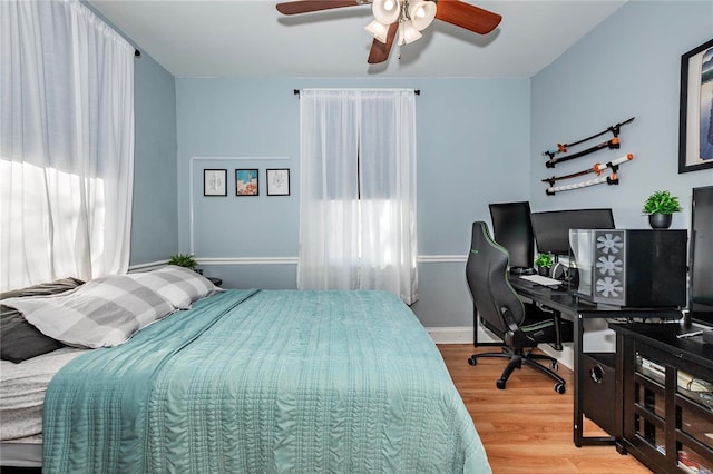 bedroom featuring hardwood / wood-style floors and ceiling fan