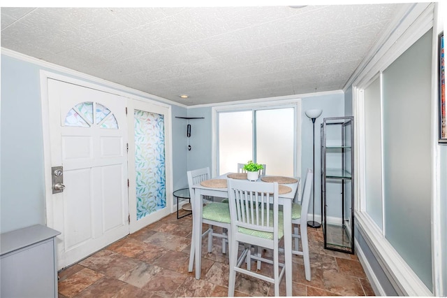 dining room featuring ornamental molding