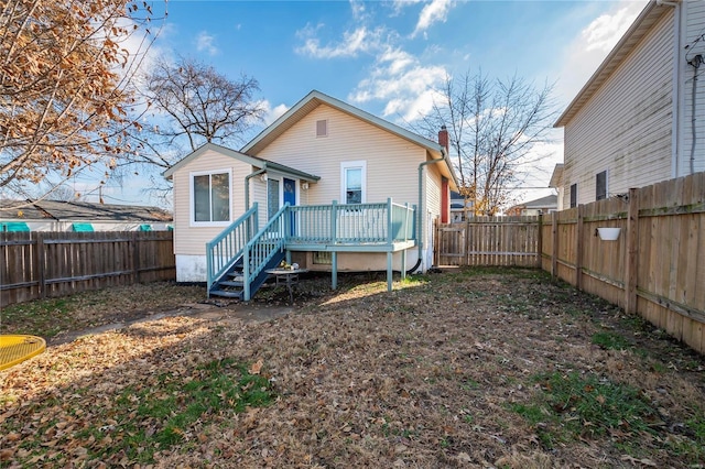 rear view of property with a deck