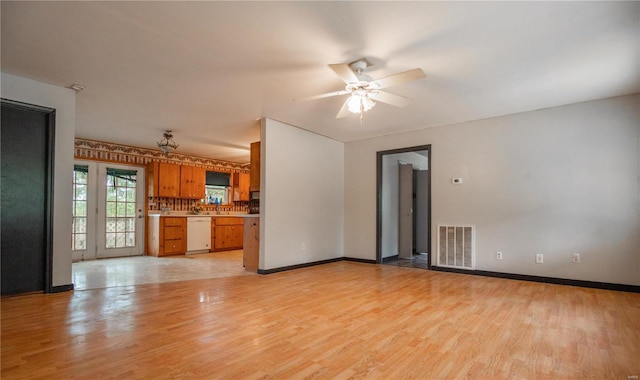 unfurnished living room featuring light hardwood / wood-style floors and ceiling fan