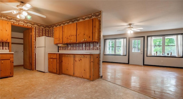 kitchen with ceiling fan and white refrigerator