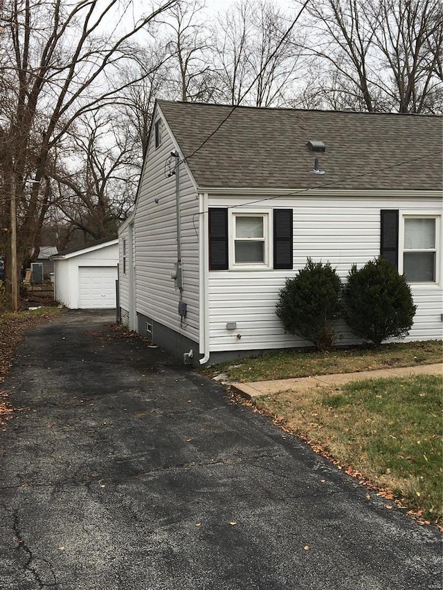 view of front of property with an outbuilding and a garage