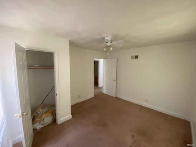 unfurnished bedroom featuring carpet flooring, a closet, and ceiling fan