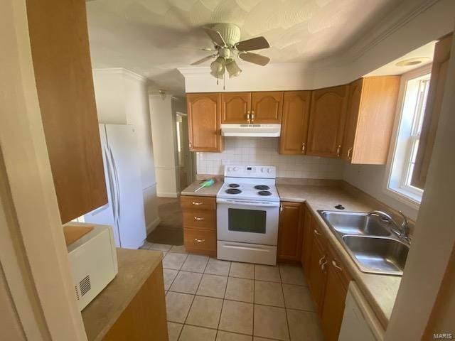 kitchen with backsplash, white appliances, ceiling fan, sink, and light tile patterned flooring