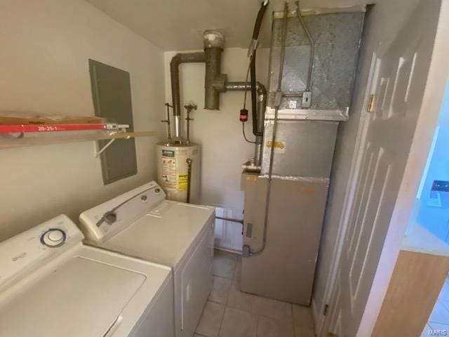 laundry area with washer and dryer, gas water heater, heating unit, and light tile patterned flooring