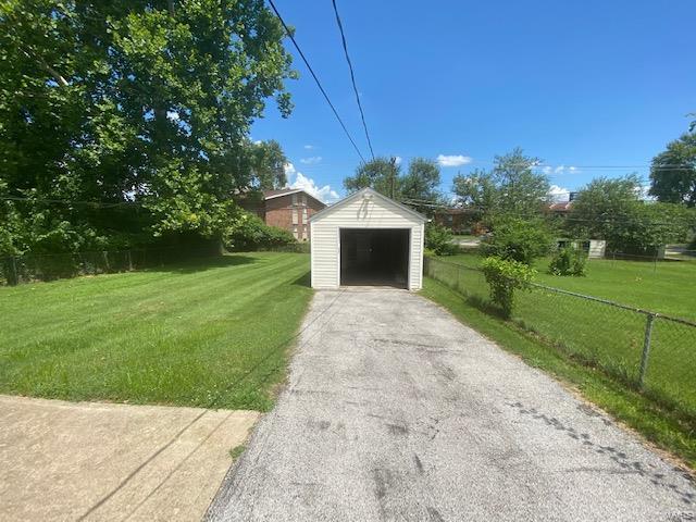 garage with a yard