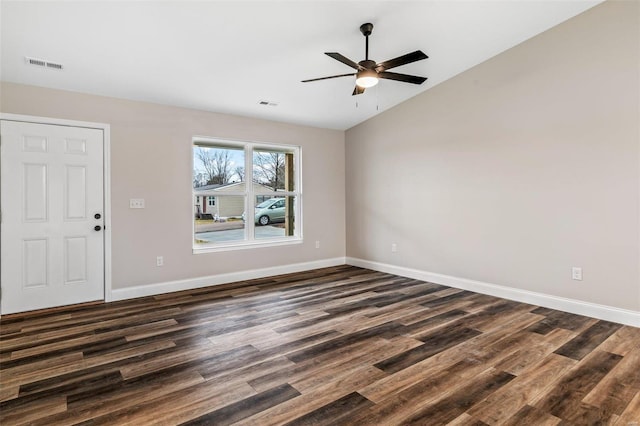 spare room with lofted ceiling, ceiling fan, and dark hardwood / wood-style floors