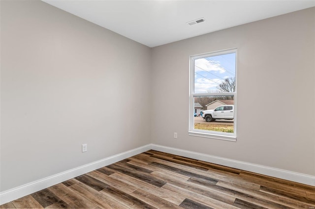 unfurnished room featuring wood-type flooring