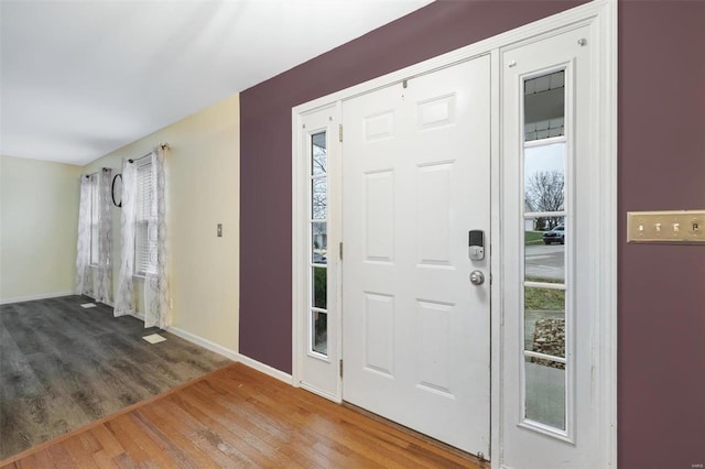 entryway with hardwood / wood-style flooring