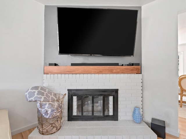 interior details with a fireplace and hardwood / wood-style floors