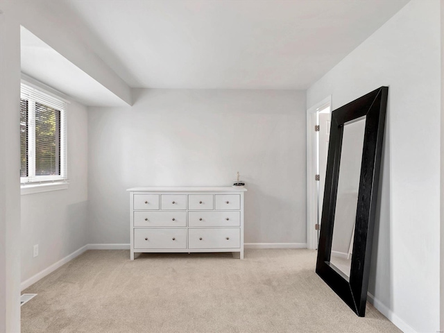 unfurnished bedroom with light carpet