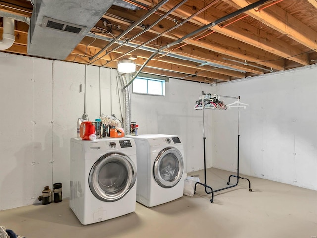 washroom featuring independent washer and dryer