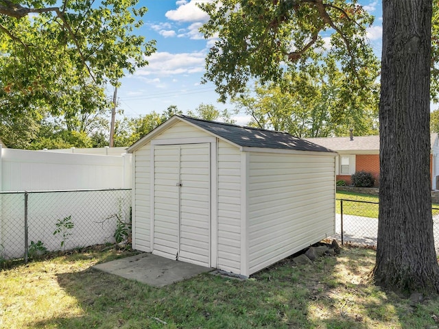 view of outbuilding with a lawn