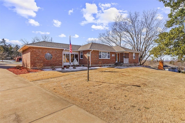 ranch-style house with a front lawn