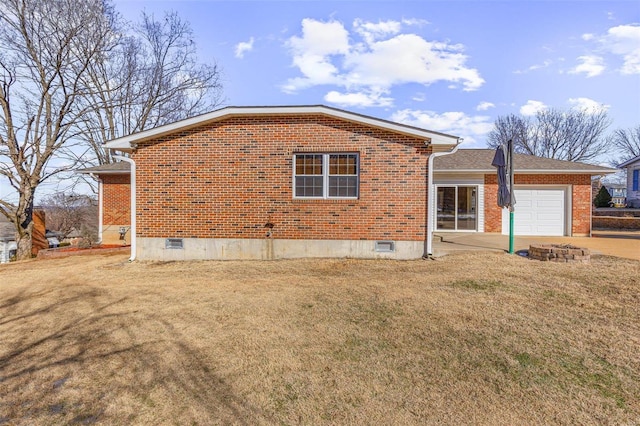 exterior space with a garage and a front yard