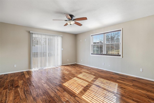 spare room featuring a textured ceiling, wood-type flooring, and ceiling fan