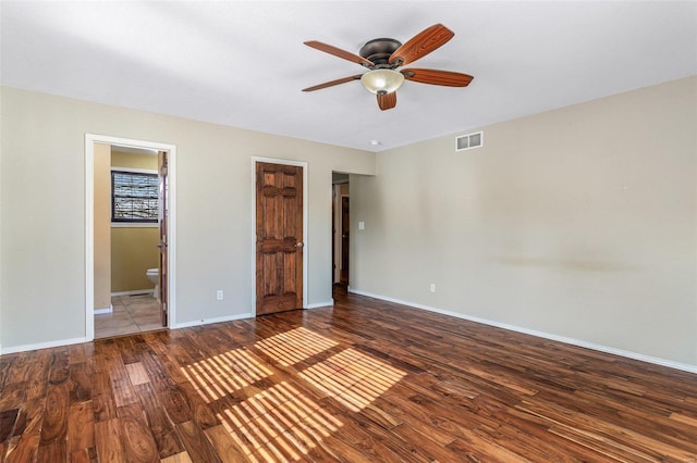 unfurnished bedroom with hardwood / wood-style floors, ensuite bath, and ceiling fan