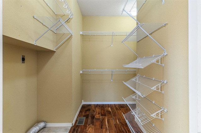 spacious closet featuring wood-type flooring