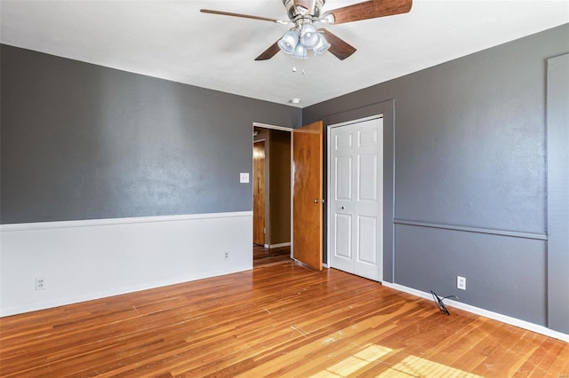 unfurnished bedroom featuring a closet, ceiling fan, and light hardwood / wood-style flooring