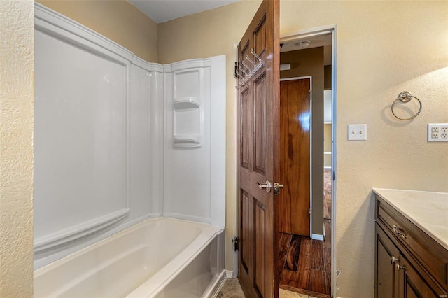 bathroom with vanity and bathing tub / shower combination