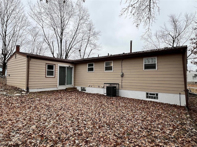 back of house featuring central AC