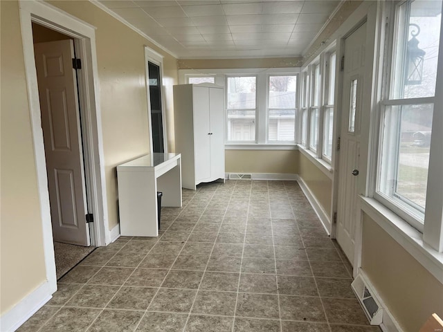 unfurnished sunroom with plenty of natural light