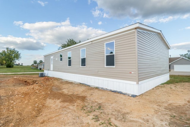 view of side of property with cooling unit