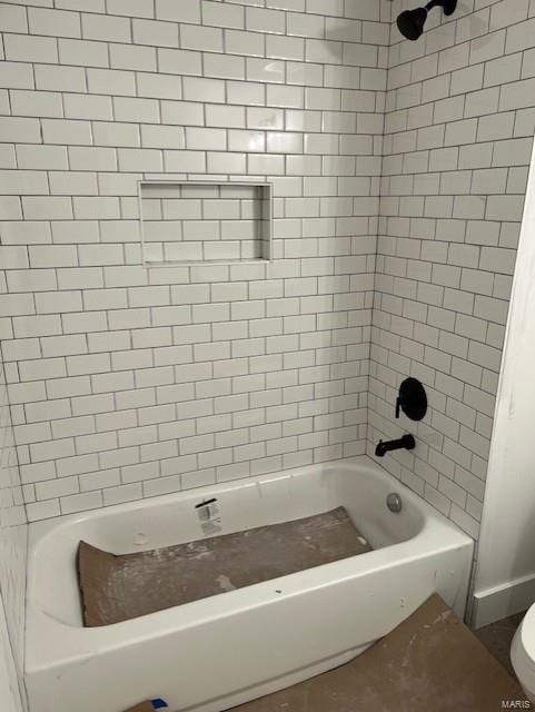 full bathroom featuring bathtub / shower combination and toilet