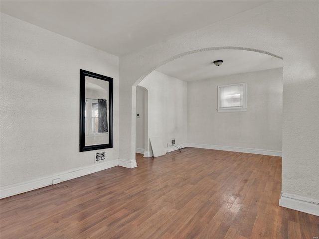 empty room featuring hardwood / wood-style floors