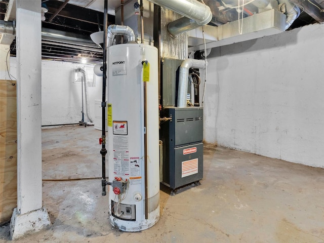 utility room featuring water heater and heating unit