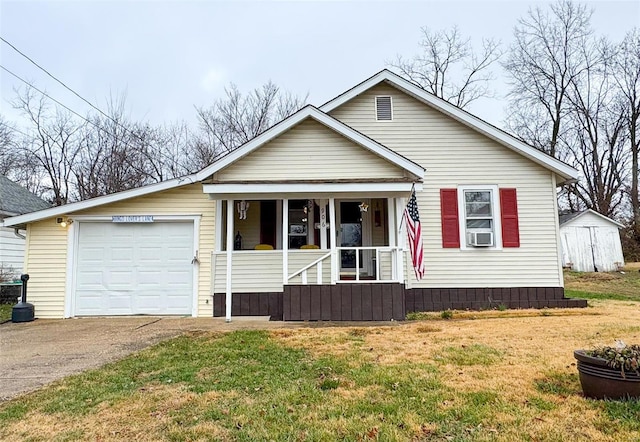 view of front of property with covered porch, a garage, and a front lawn