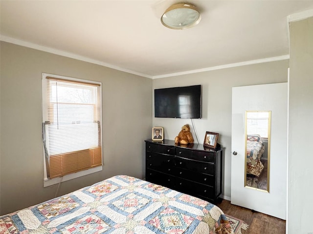 bedroom featuring crown molding and dark hardwood / wood-style flooring