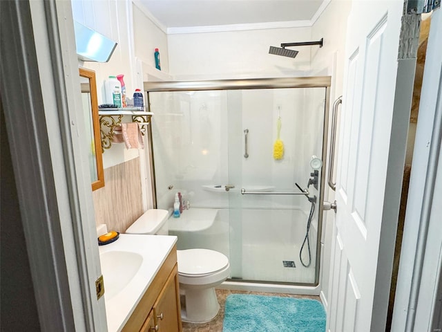 bathroom with vanity, crown molding, tile patterned flooring, toilet, and a shower with shower door