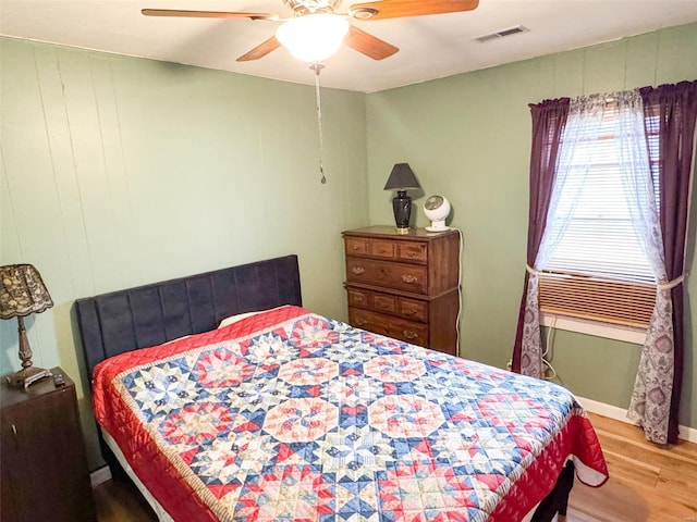 bedroom featuring ceiling fan and wood-type flooring