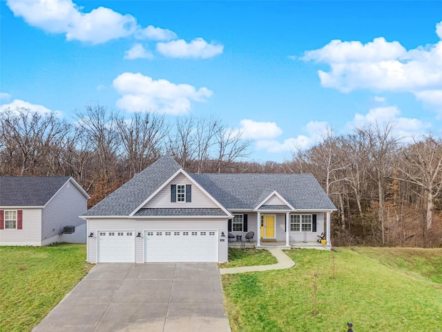 view of front of home featuring a porch, a garage, and a front yard