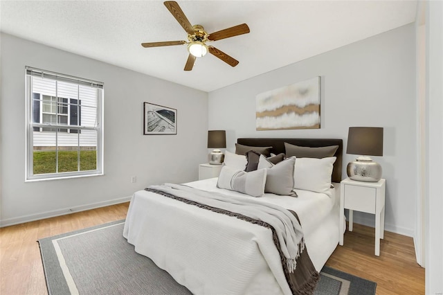 bedroom featuring ceiling fan and wood-type flooring