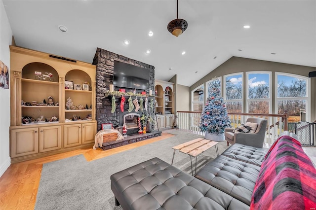 living room featuring built in features, vaulted ceiling, wood finished floors, and recessed lighting