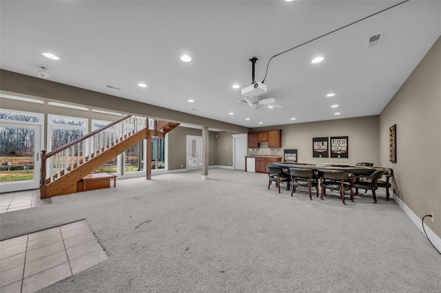 dining room with recessed lighting, visible vents, light colored carpet, stairway, and baseboards