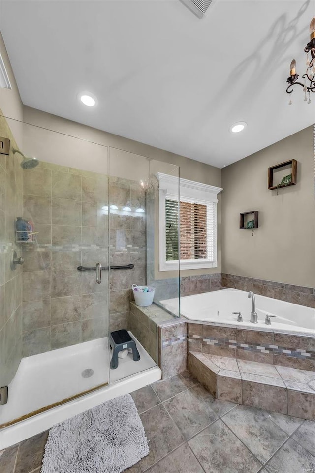 full bathroom with a garden tub and a shower stall