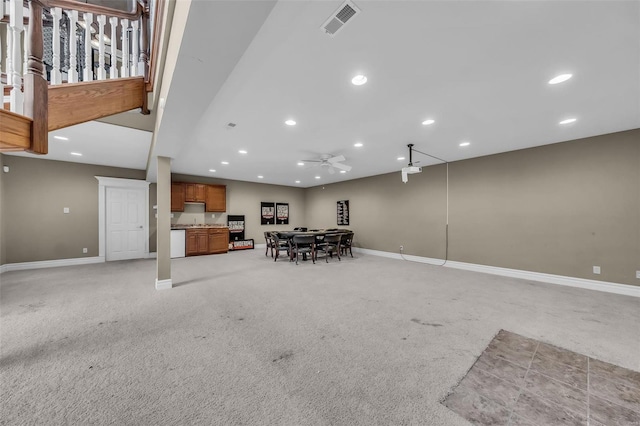 unfurnished dining area with recessed lighting, light colored carpet, and baseboards