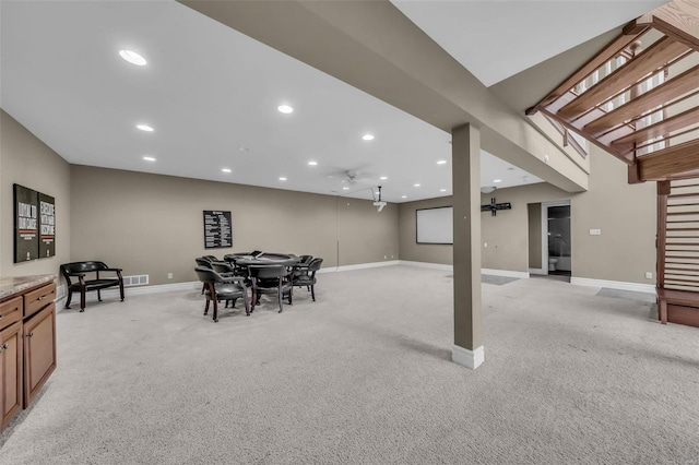 below grade area featuring recessed lighting, light colored carpet, visible vents, and baseboards