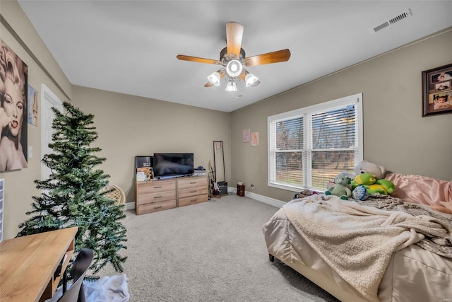 bedroom featuring carpet, visible vents, ceiling fan, and baseboards