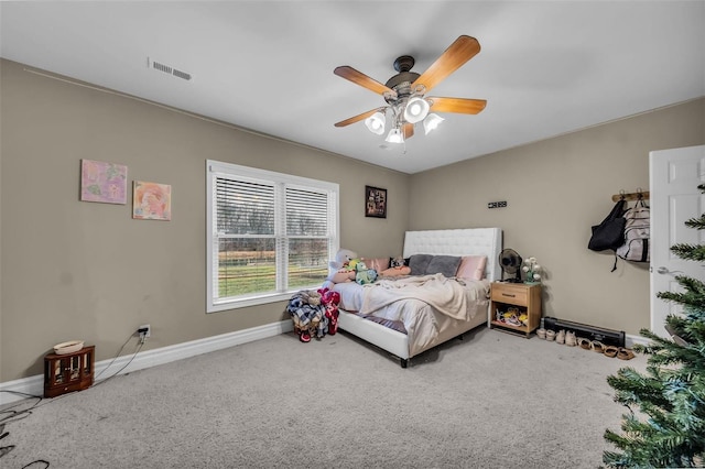 bedroom featuring a ceiling fan, carpet, visible vents, and baseboards