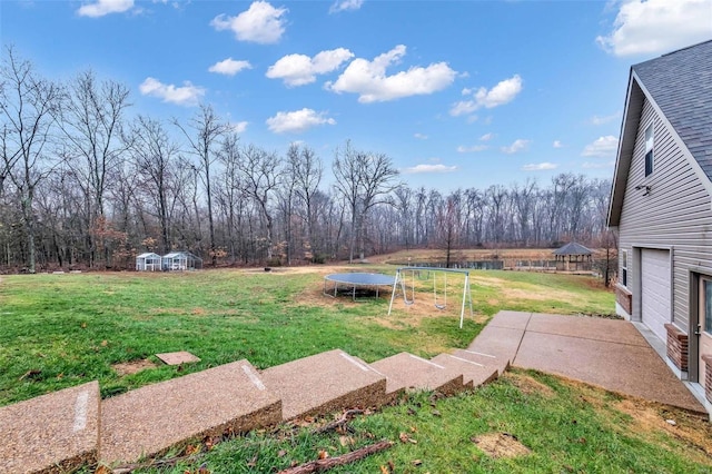 view of yard with a trampoline