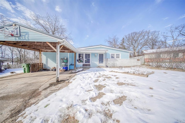 view of front of property with a carport