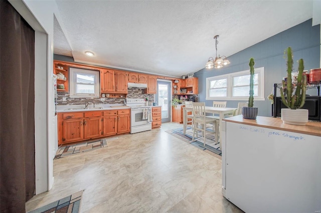 kitchen featuring decorative light fixtures, a textured ceiling, lofted ceiling, electric stove, and a chandelier