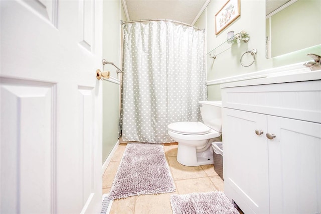 bathroom featuring toilet, tile patterned flooring, and crown molding