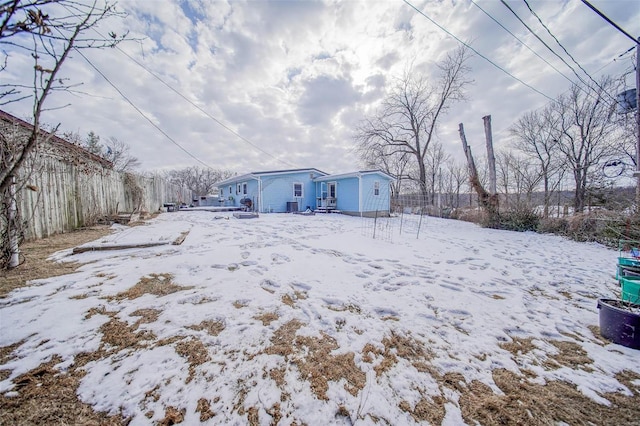 view of yard layered in snow